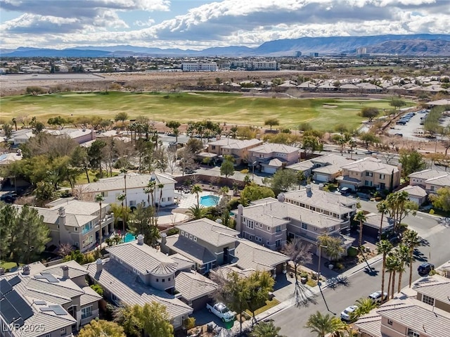 aerial view featuring a residential view, a mountain view, and golf course view