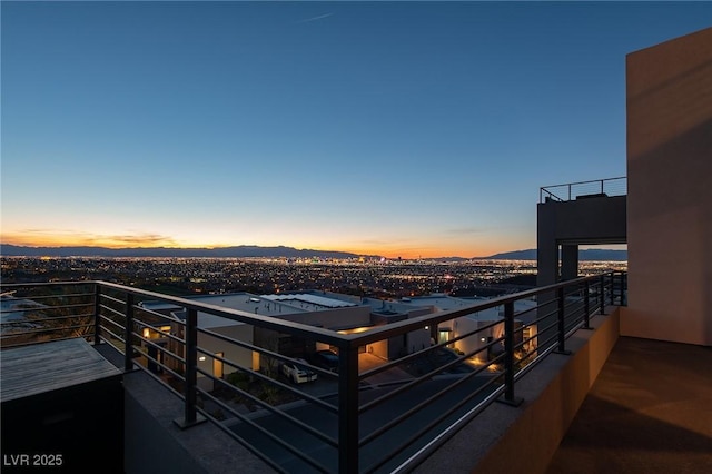 view of balcony at dusk