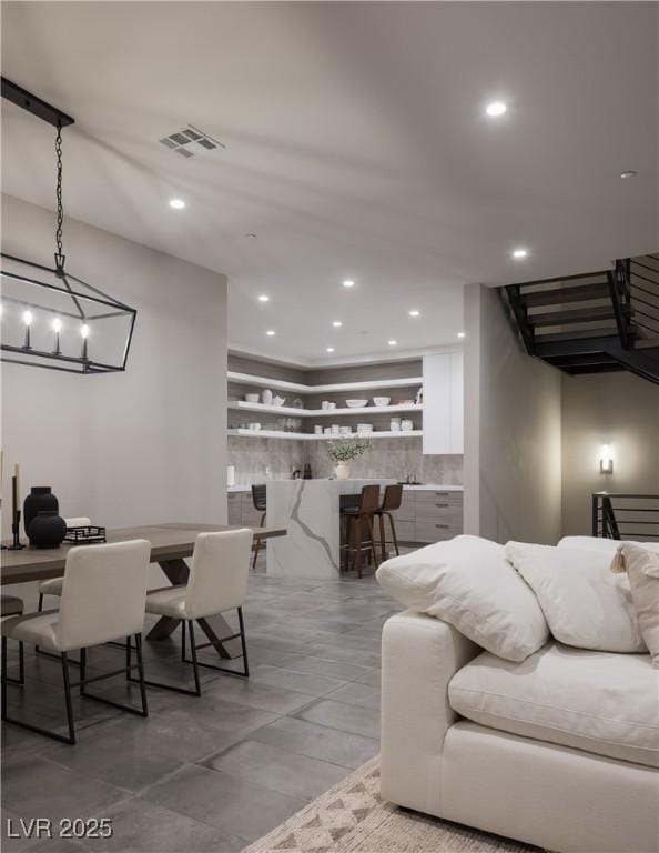 living area with recessed lighting and visible vents