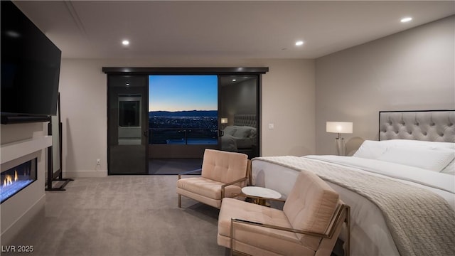 bedroom with access to exterior, recessed lighting, a glass covered fireplace, carpet flooring, and baseboards