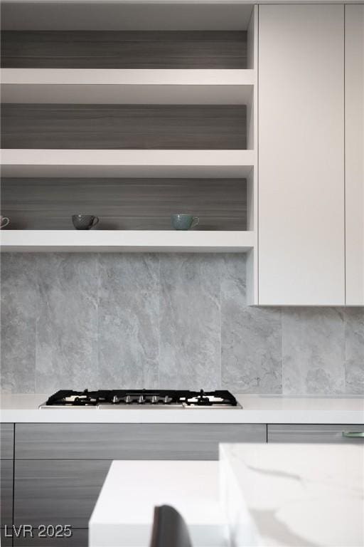 kitchen featuring light countertops, modern cabinets, gas stovetop, and white cabinetry