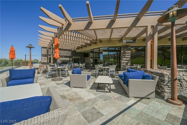 view of patio / terrace featuring an outdoor living space and a pergola