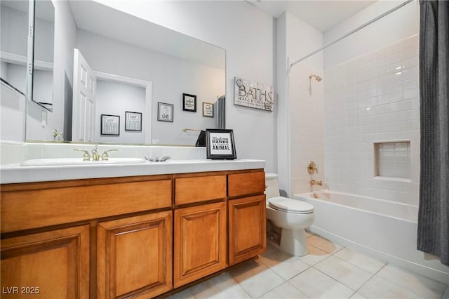 bathroom with shower / tub combo with curtain, vanity, toilet, and tile patterned floors