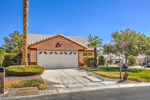 view of front of property with concrete driveway, a tiled roof, and stucco siding