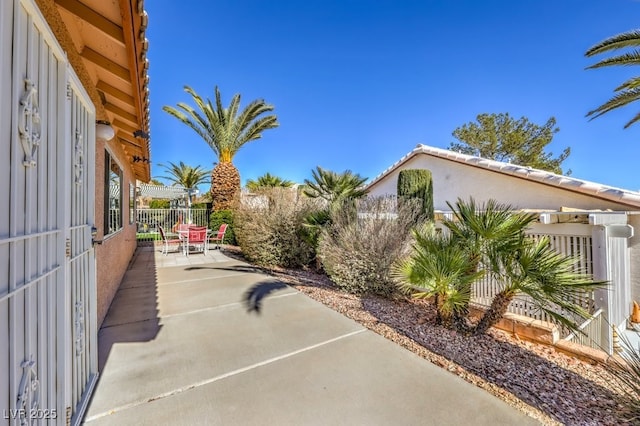 view of patio / terrace featuring fence and a pergola