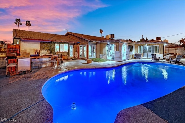 pool featuring a patio area