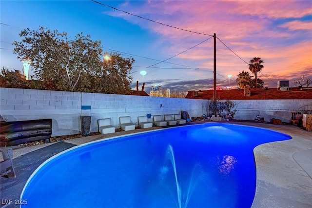 view of swimming pool featuring a fenced backyard and a fenced in pool