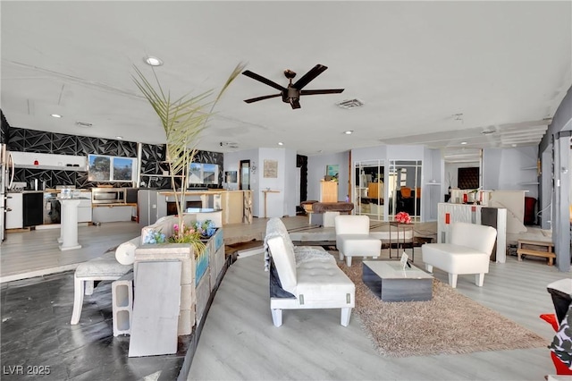 living room featuring recessed lighting, decorative columns, visible vents, and a ceiling fan