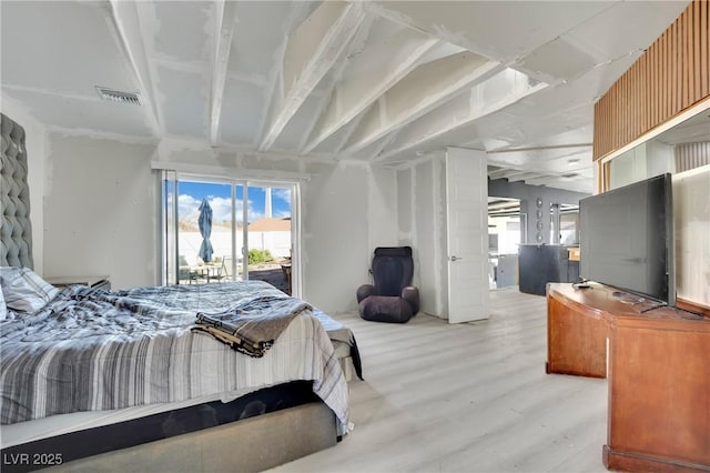 bedroom featuring access to outside, light wood-type flooring, and visible vents