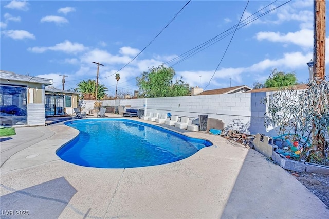 view of pool with a fenced in pool, a patio area, and a fenced backyard