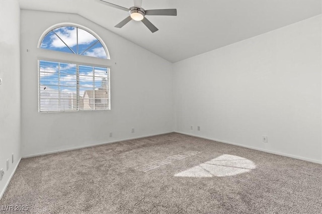 spare room featuring baseboards, high vaulted ceiling, a ceiling fan, and carpet