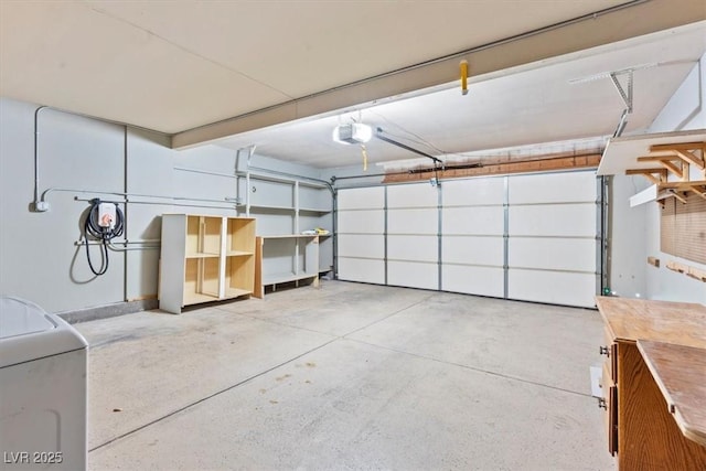 garage with washer / clothes dryer and a garage door opener