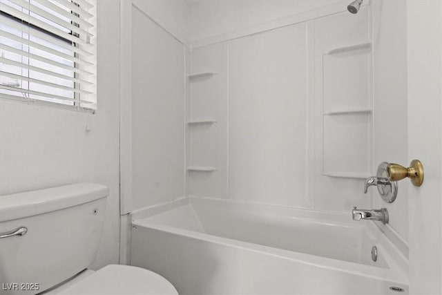 bathroom with toilet and shower / bath combination