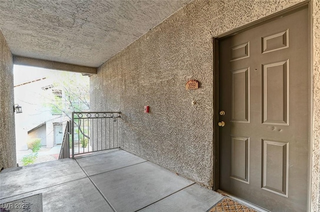 property entrance featuring stucco siding