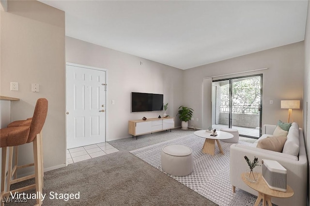 living room featuring light tile patterned flooring and light colored carpet