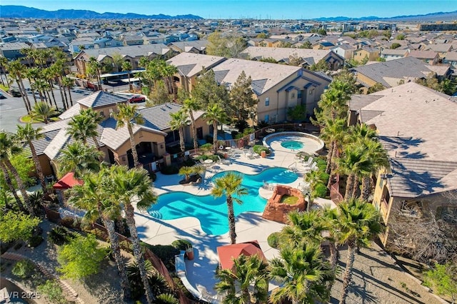 exterior space featuring a residential view, a patio area, and a mountain view