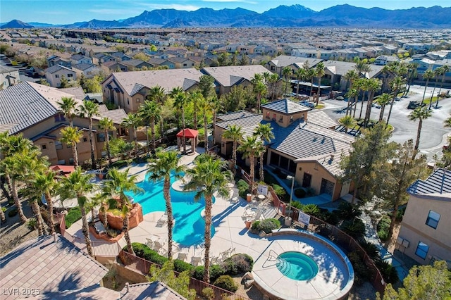 drone / aerial view featuring a residential view and a mountain view