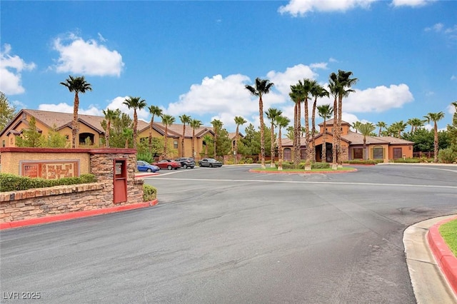 view of road featuring curbs and a residential view