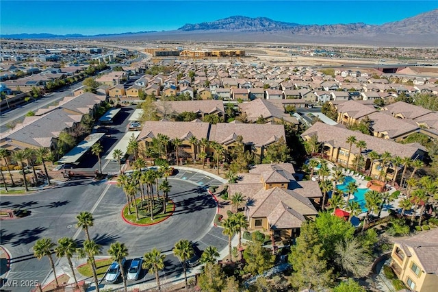 drone / aerial view featuring a residential view and a mountain view