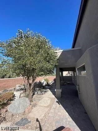 view of patio featuring fence