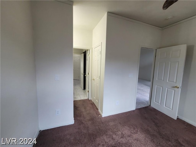 unfurnished bedroom with carpet floors and baseboards