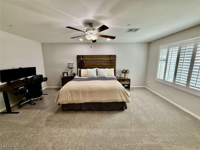 carpeted bedroom featuring a ceiling fan, visible vents, and baseboards