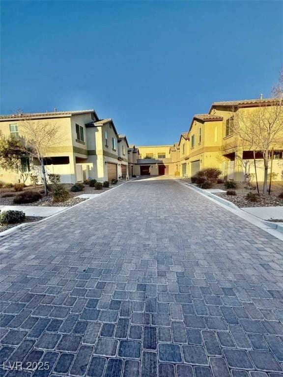 view of street with curbs and a residential view