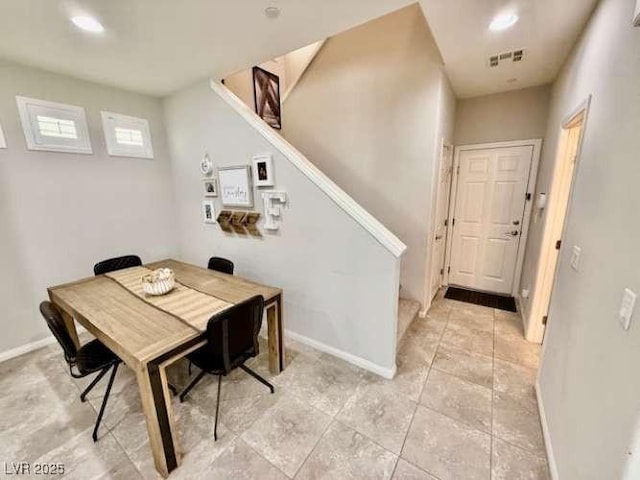 dining space with baseboards, stairs, visible vents, and recessed lighting