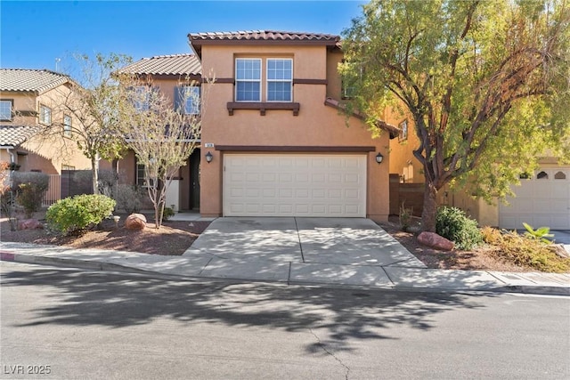 view of front of property featuring a garage, fence, concrete driveway, a tiled roof, and stucco siding