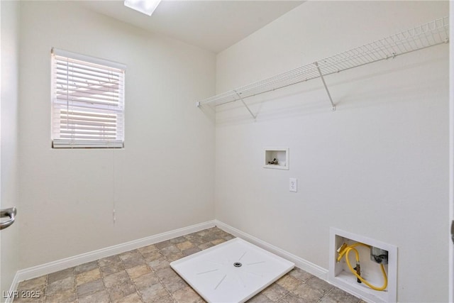 washroom featuring laundry area, baseboards, and washer hookup