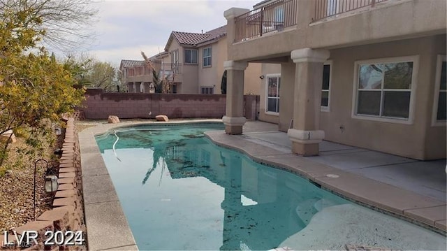 view of swimming pool featuring a fenced in pool, a patio area, and a fenced backyard