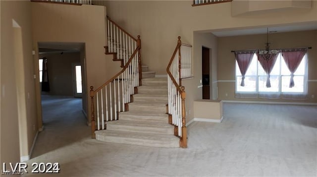 stairway with carpet floors and baseboards