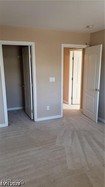 4798 Luna Ridge Ct, Las Vegas, NV 89129 - unfurnished bedroom featuring baseboards, light carpet, and a closet
