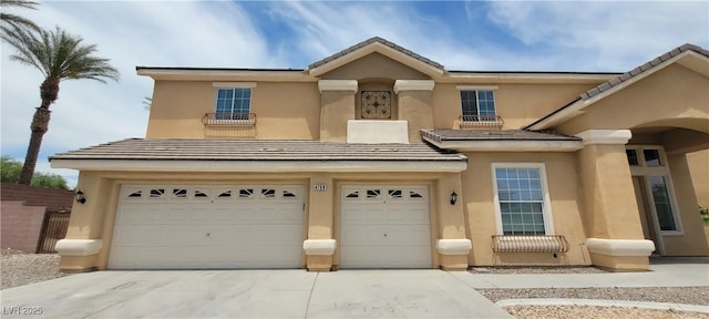 4798 Luna Ridge Ct, Las Vegas, NV 89129 - view of front of house with a garage, stucco siding, driveway, and a tiled roof