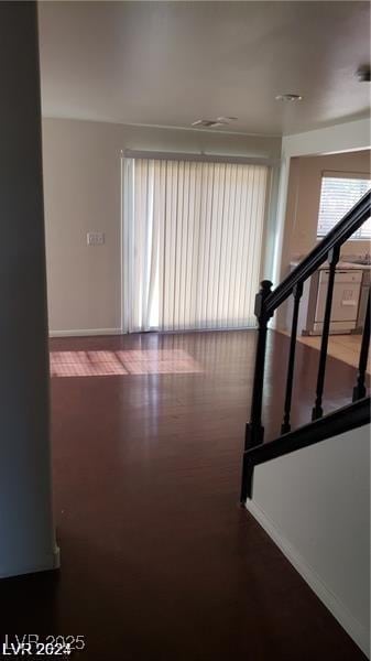 stairs with baseboards and wood finished floors