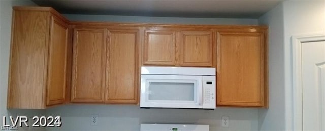 kitchen with white microwave