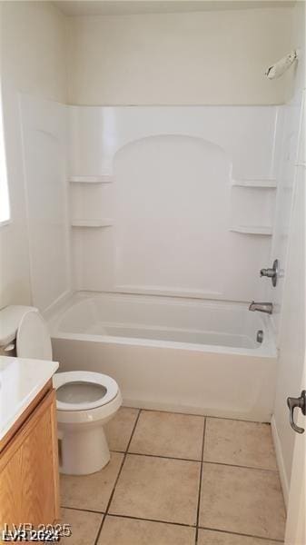 bathroom featuring toilet, tile patterned floors, shower / washtub combination, and vanity