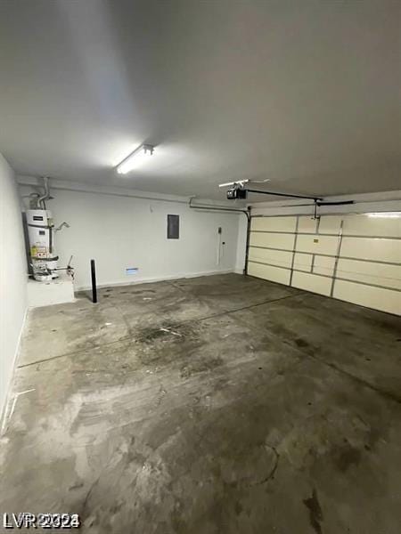 garage with secured water heater and a garage door opener