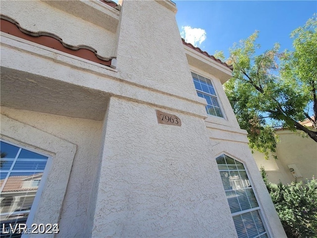 details featuring stucco siding