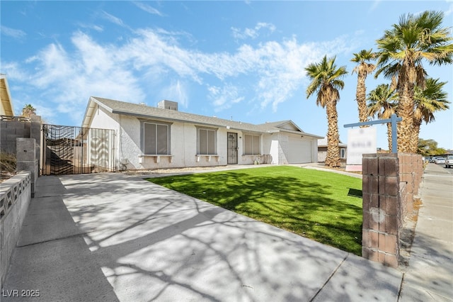 ranch-style home featuring concrete driveway, a front yard, stucco siding, a garage, and a gate