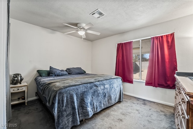 carpeted bedroom featuring visible vents, baseboards, a textured ceiling, and ceiling fan