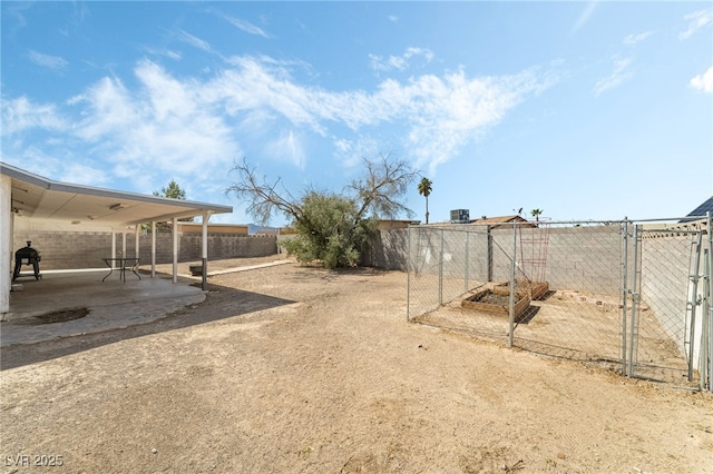 view of yard featuring a patio and a fenced backyard