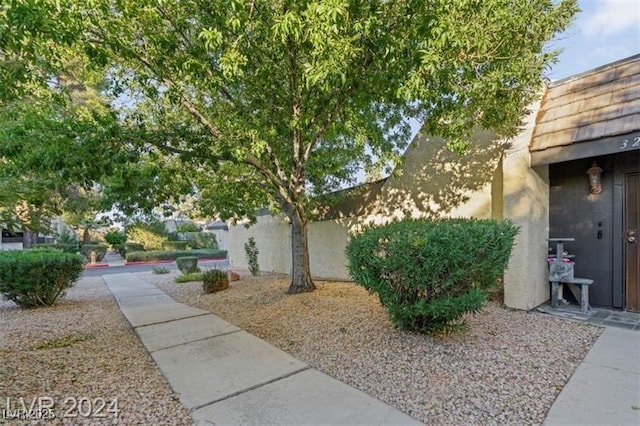 view of side of property featuring fence