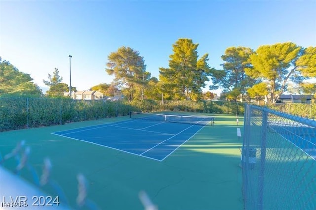 view of sport court with fence