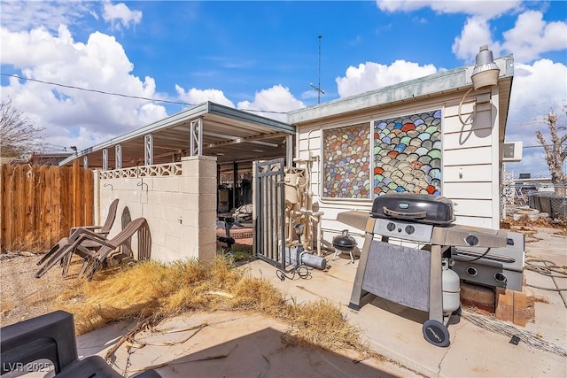 view of home's exterior featuring fence