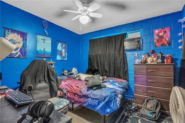 bedroom with ceiling fan, cooling unit, carpet flooring, and a textured ceiling