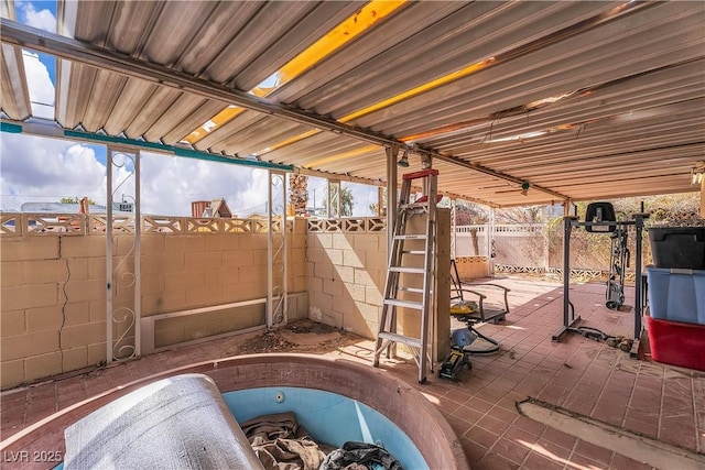 view of patio featuring fence