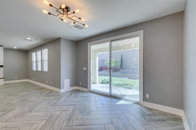981 Soaring Moon Dr, Henderson, NV 89015 - spare room with baseboards and a chandelier