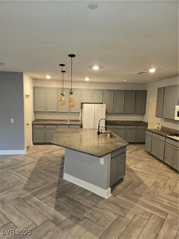 981 Soaring Moon Dr, Henderson, NV 89015 - kitchen featuring freestanding refrigerator, a sink, gray cabinetry, and recessed lighting
