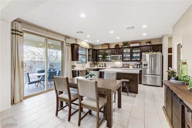 dining room with recessed lighting and visible vents